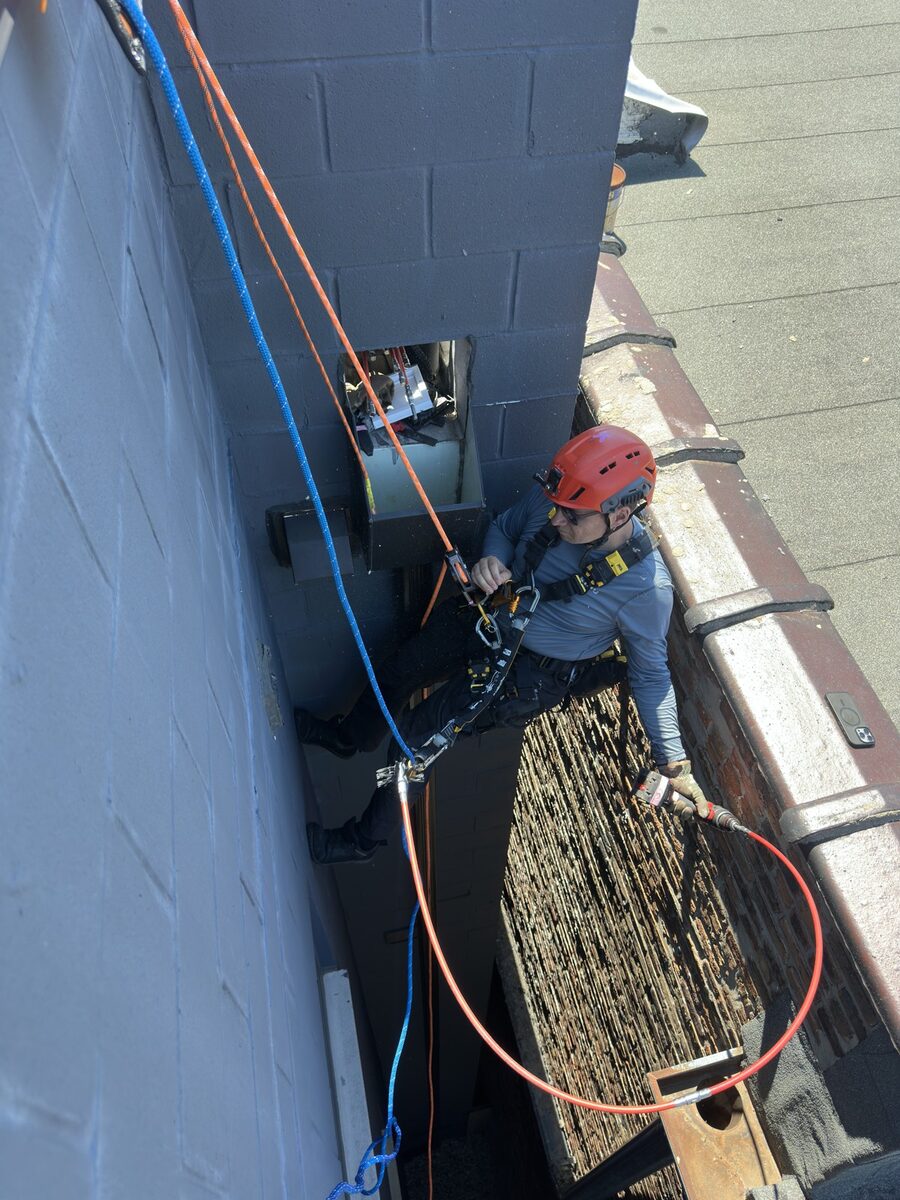 Kobicos technician descending a Chicago building on rope